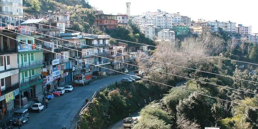 Image of Shoghi town, busy road and houses on top of the hills - hill stations near Ludhiana