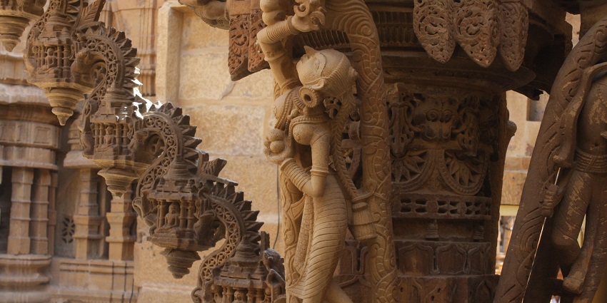 Carved statue of a female devotee inside one of the famous Jain temples in Ahmedabad.