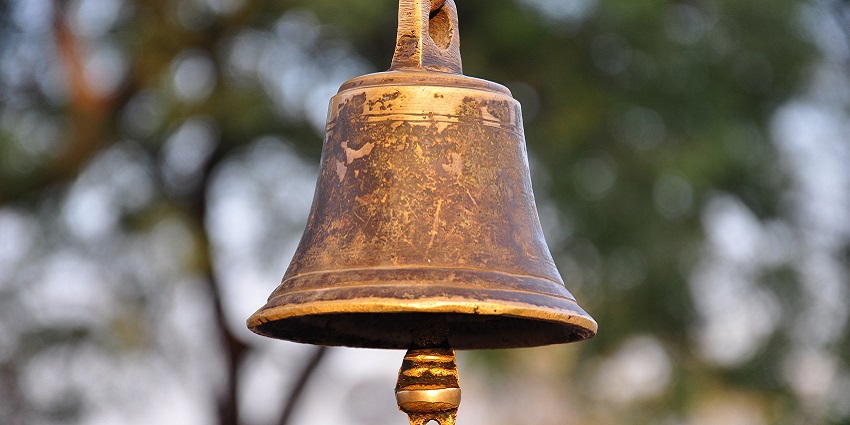 Close-up of a large, ornate bell featuring intricate carvings at one of the temples in Jodhpur.