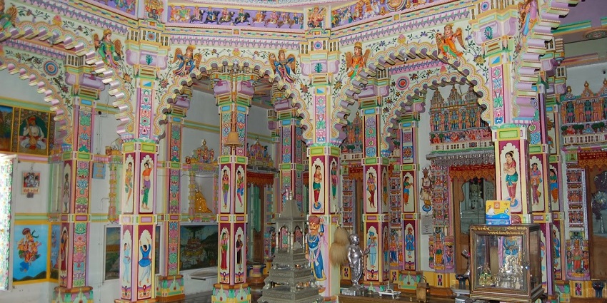 The colorful and artistic craft work and murals inside one of the temples in Gujarat.