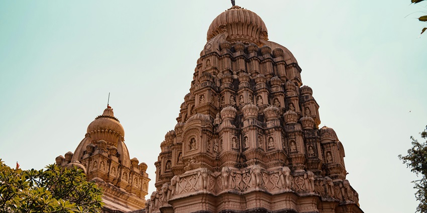 A picture of a temple with an intricate design and traditional Hindu architecture