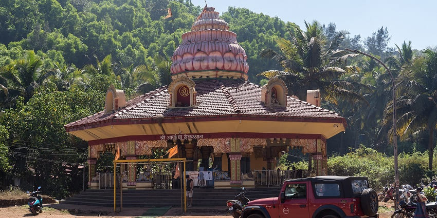A small yet tranquil temple nestled in nature, with traditional architecture and spiritual charm.
