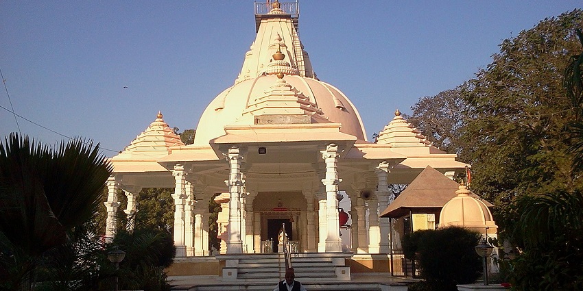 Wide angle view of the temple building, showcasing the dome shaped architecture