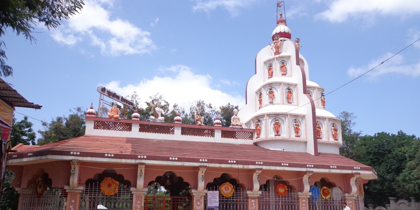 The front view of the temple and its complex with elaborate sculptures and carvings.