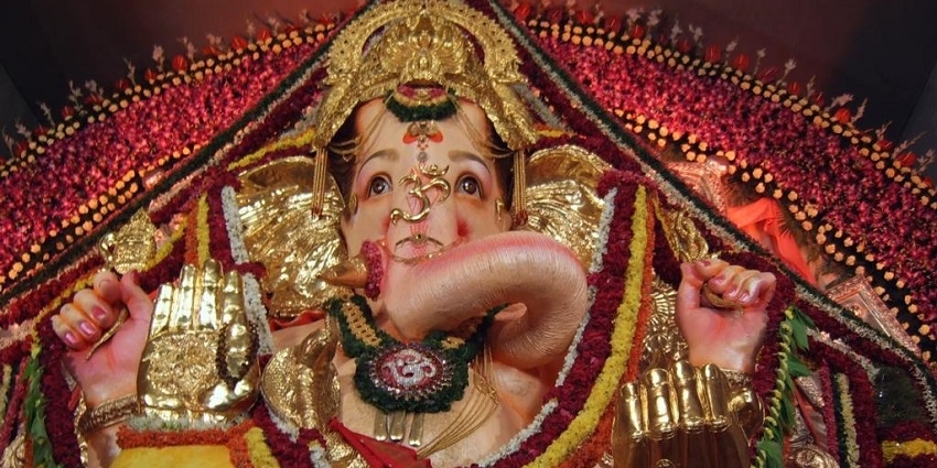 Ganesha temple features intricate design, peaceful, community celebrations, serene gardens.