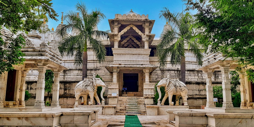 A serene view of Shri Panchasara Parshwanath Jain Derasar, showcasing its intricate architecture