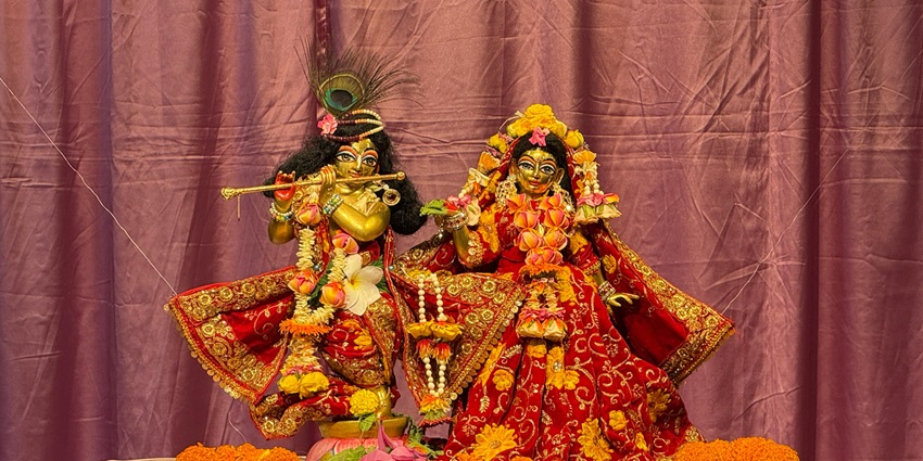 Colorful Krishna and Radha Statues with Draped Background - Shri Radha Damodar Temple