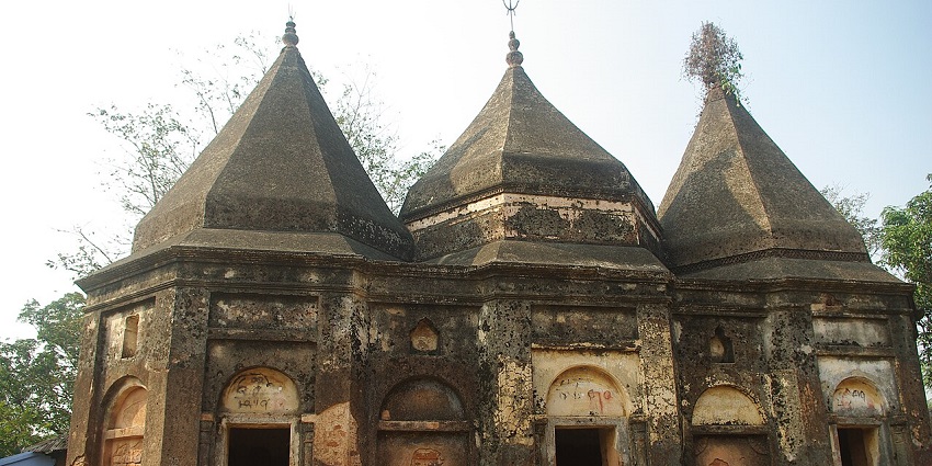 Shiv Mandir nestled in Sakchi market, featuring traditional sanctum, vibrant shrines, and daily rituals amid bustling shops.
