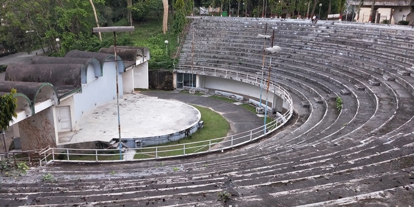 Image of an open theatre in Shrimanta Shankardeva Kalakshetra surrounded by greenery