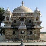 Majestic brown columns of Shrinathji temple highlighting stunning architectural elegance.