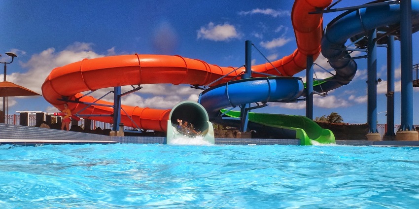 Refreshing blue pool and slide at a Nepal waterpark that is ideal for relaxation