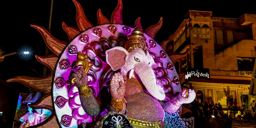 A picture of an idol of Lord Ganesh in a temple in Delhi with beautiful lighting and decorations