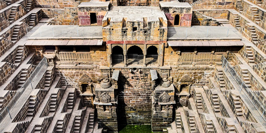 The intricate architecture of Siddhpur Stepwell, showcasing detailed carvings and stone steps.