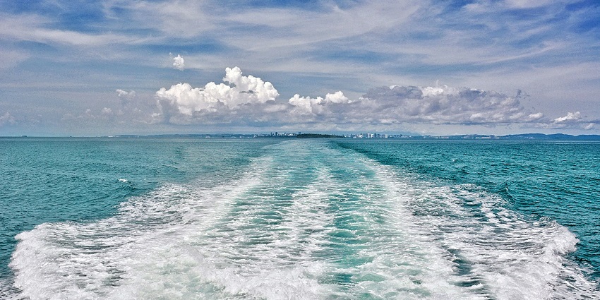 A breathtaking view of a sparkling blue body of water in Sihanoukville during the day.
