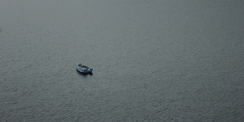A serene view of the Siliserh Lake in Alwar, Rajasthan showing the lake's azure waters.