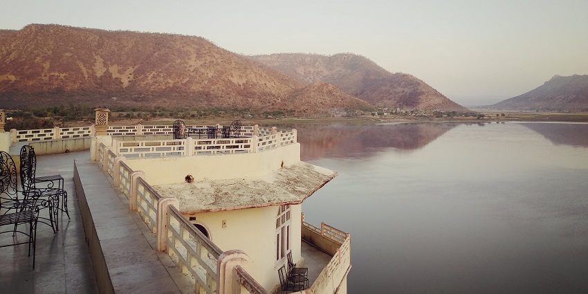 Siliserh Lake, a popular destination near Sariska National Park, is a peaceful spot surrounded by scenic hills and nature.