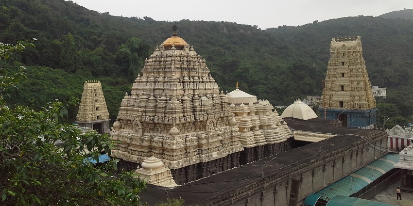  A picture of a temple taken from a distance, made with the traditional Hindu architecture