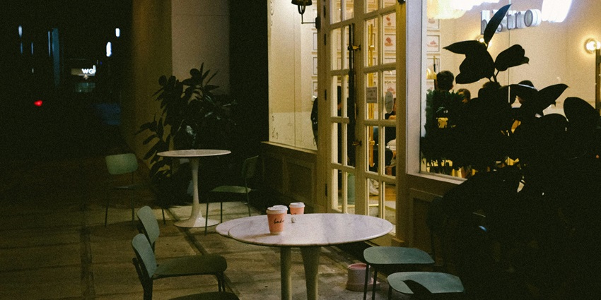 A picture of an ambient cafe in Karol Bagh with people enjoying the delectable food