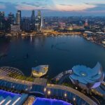 The beautiful skyline of Singapore with high-rise buildings and vibrant city lights.