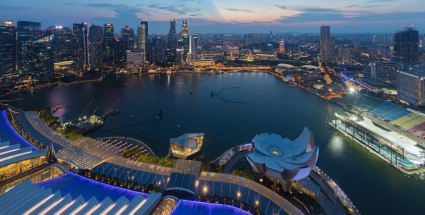 The beautiful skyline of Singapore with high-rise buildings and vibrant city lights.