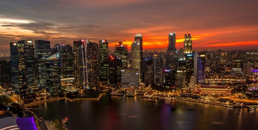 Singapore skyline at sunset, showcasing the city's skyscrapers and urban landscape.