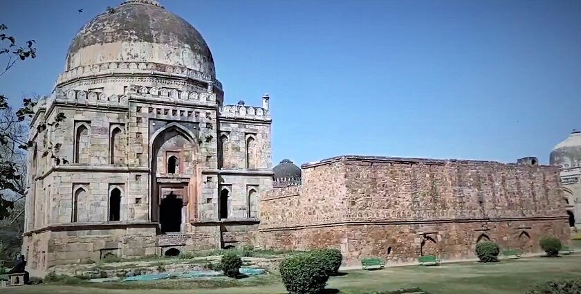 A picture of a fort in Delhi that was built in the 14th century with a garden in front of it