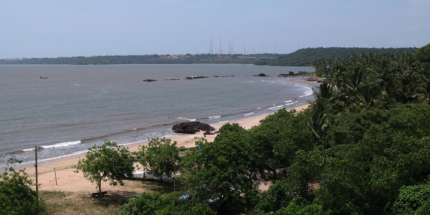 Aerial panoramic view of the magnificent Siridao Beach near Panjim in Goa amidst the lush trees
