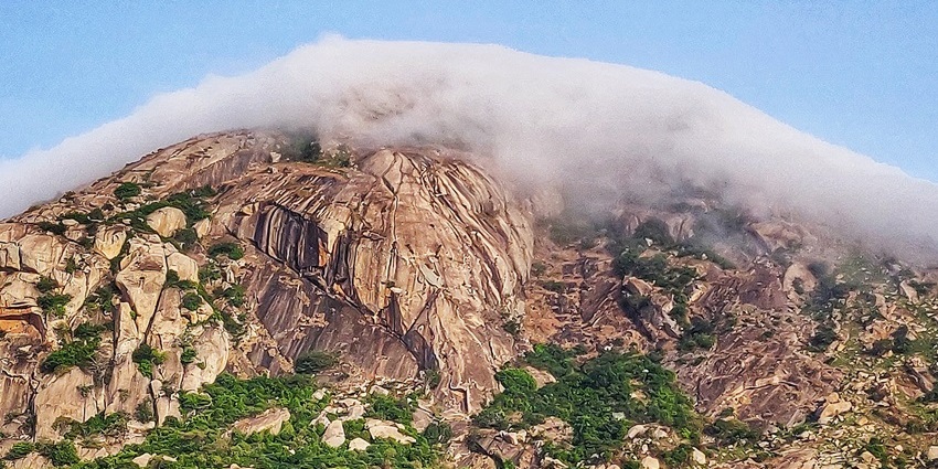 Skandagiri clouds over lush hills making it one of the best hill stations near Bangalore.