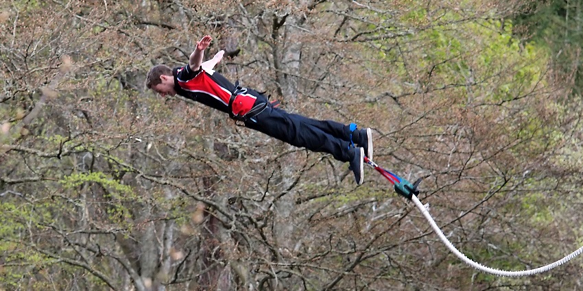 A mindblowing view of a person enjoying an adventurous activity during the daytime.