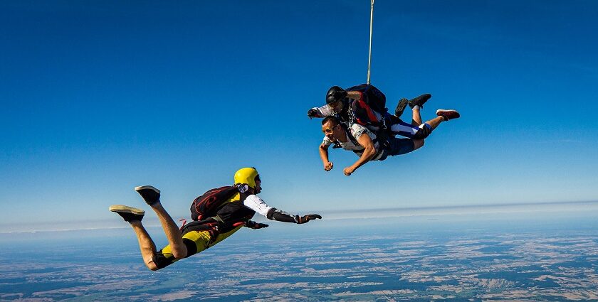 Image of a group of skydivers leaps from a plane - explore best Skydiving near delhi