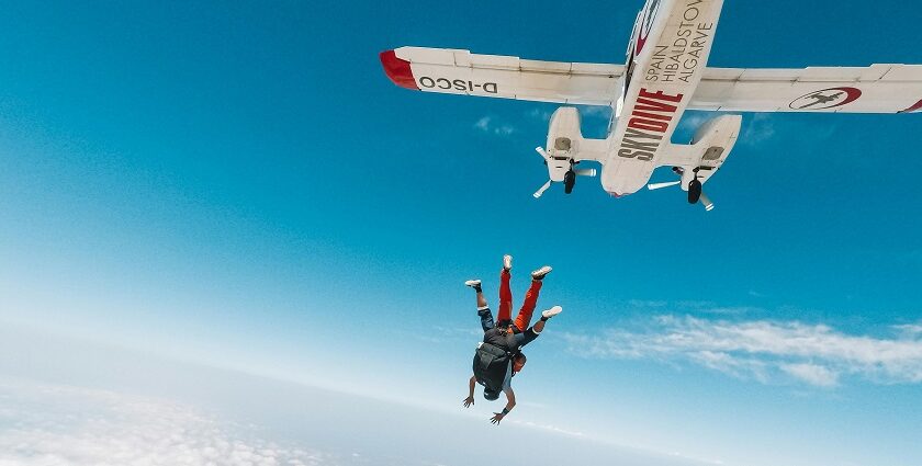 Person skydiving in Pokhara with a clear sky from a great height for a thrilling adventure.