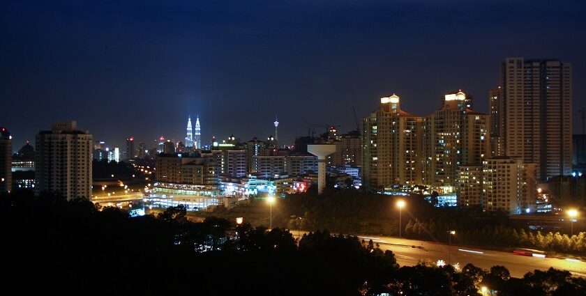 Kuala Lumpur skyline by night with Mont Kiara district in the foreground offering scenic views.