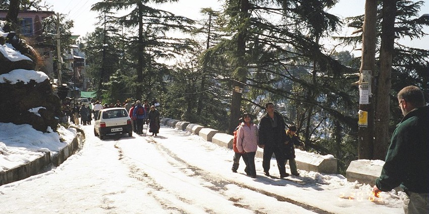 Panoramic view of Mcleodganj weather with its scenic mountain backdrop and snow-covered streets