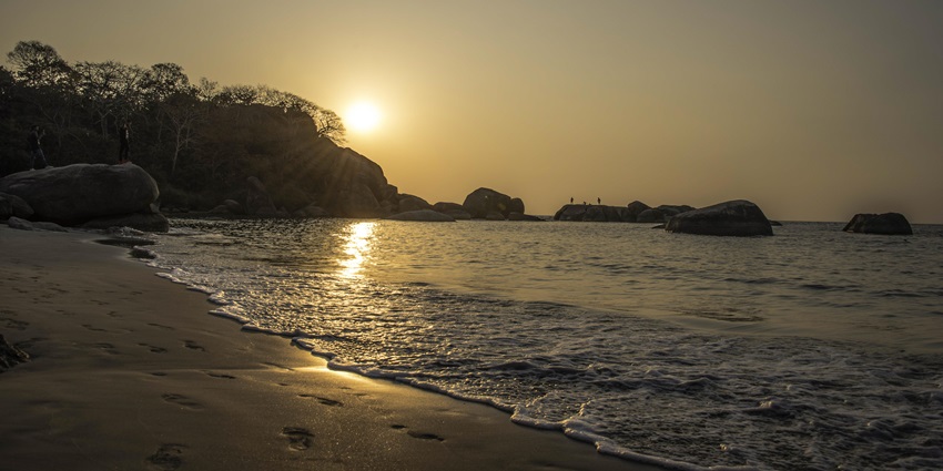 A serene beach in South Goa with golden sands, calm waves, and stunning sunset views, one of the best things to do in South Goa with family.