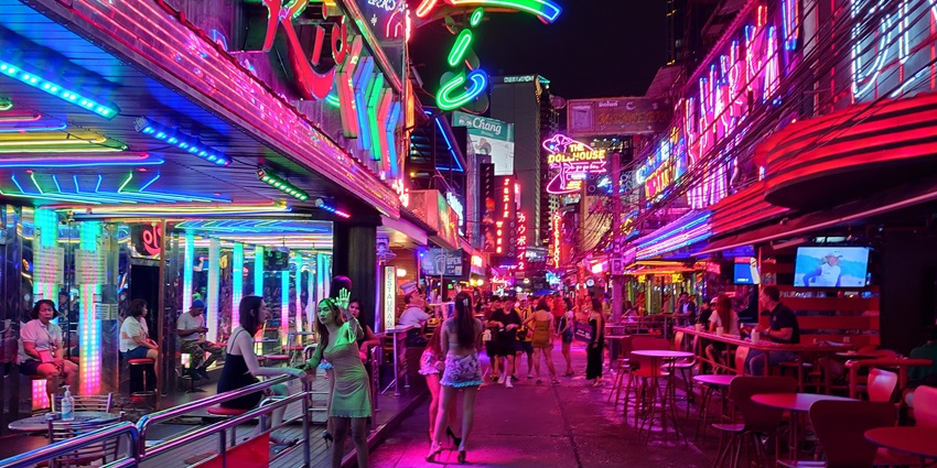 An image of Soi Cowboy which is one of the places to enjoy Sukhumvit Bangkok nightlife.