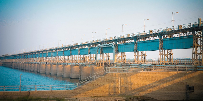 Panoramic view of a gravity Dam which is built over a beautiful river to control the flow