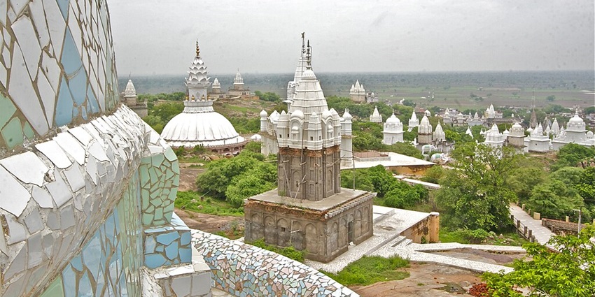 View of the white Jain temples atop Sonagiri Hill, offering a serene view