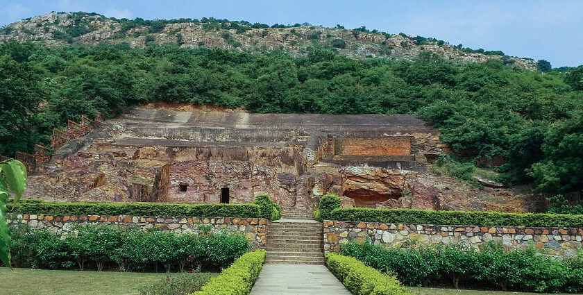 A panoramic view of Sonbhandar Caves in Rajgir, Bihar surrounded by greenery