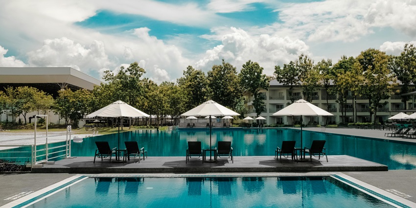 A picture of a swimming pool at a resort in Ranchi on a clear day