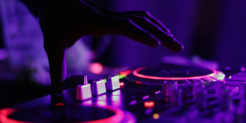 An image of a DJ with neon lights, reflecting the energetic vibe of Thimpu nightlife.