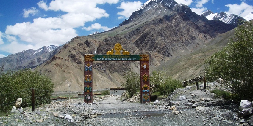 Entrance of the Spiti valley, with the rocky trekking trails and snow covered peaks of Himalayas at the back