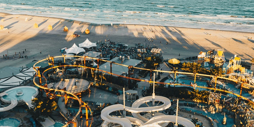 A glimpse of people enjoying leisure time at Splashdown Waterpark surrounded by waters.