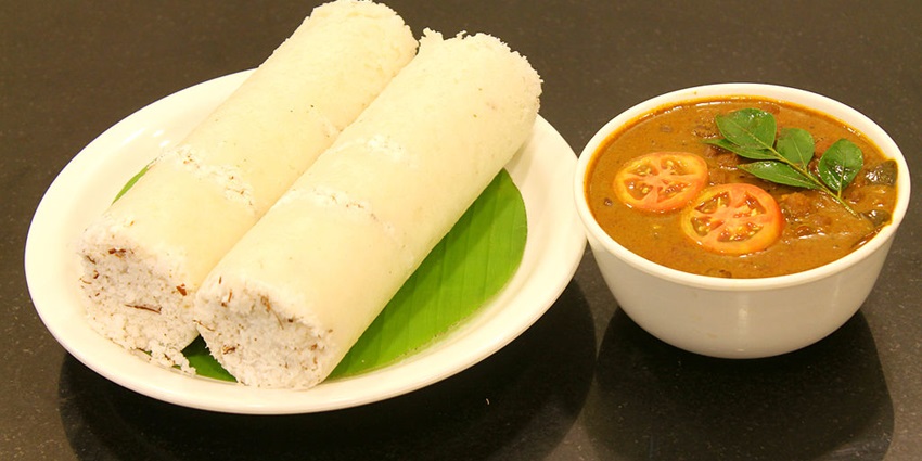 Puttu and Kadala Curry, a traditional dish served in the Sree Radha Krishna Prasada.