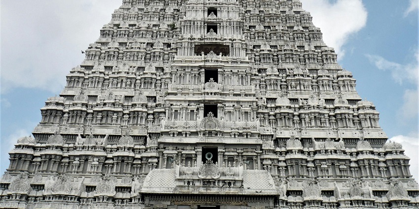 A picture of a temple clicked from the bottom and moving towards the top, during daytime