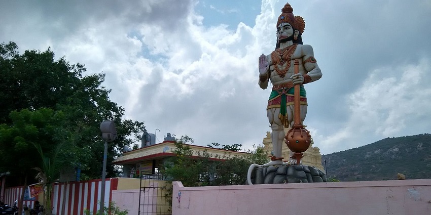 A picture of a tall statue of lord Hanuman at a temple to visit near Tirupati within 50 km