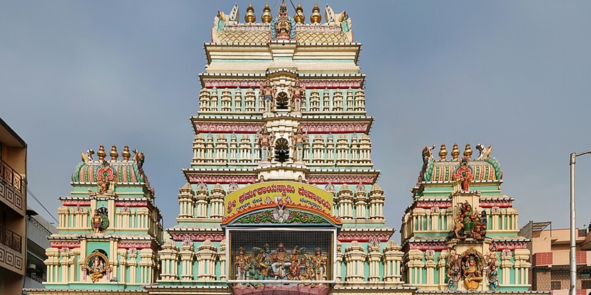 Front view of a traditional Hindu temple with ornate gopuram and detailed carvings