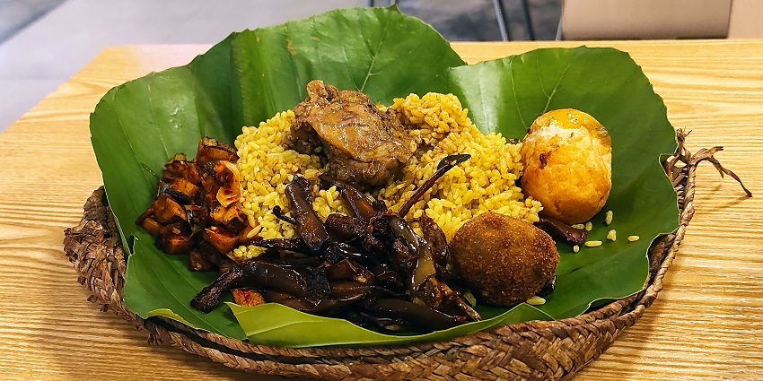 Lamprais, a traditional Sri Lankan dish with rice, meat, and vegetables wrapped in banana leaves