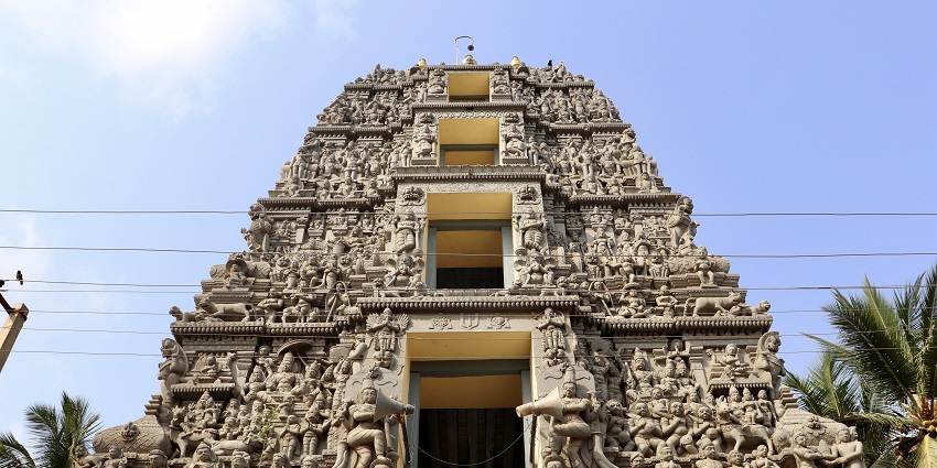 Intricate carvings on the roof of a temple, depicting ancient tales reflecting the rich heritage