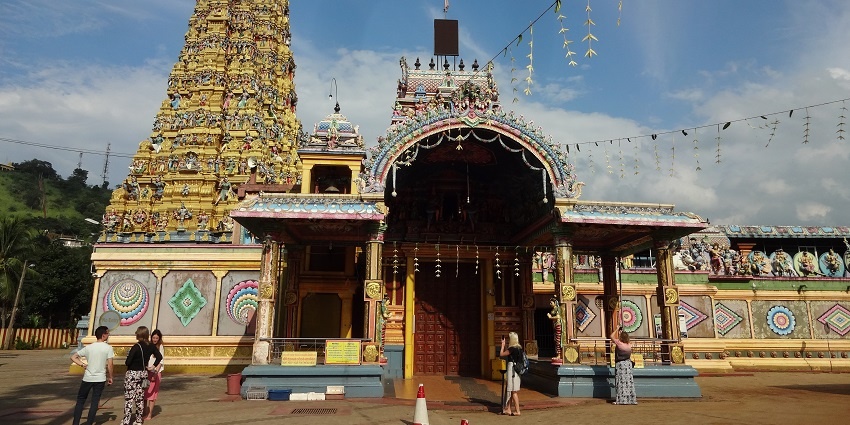 Colorful facade of Muthumariamman Temple with intricate carvings and vibrant details