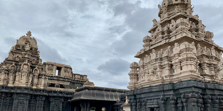 Wide angle view of the intricate carvings on the roof and pillars of the temple